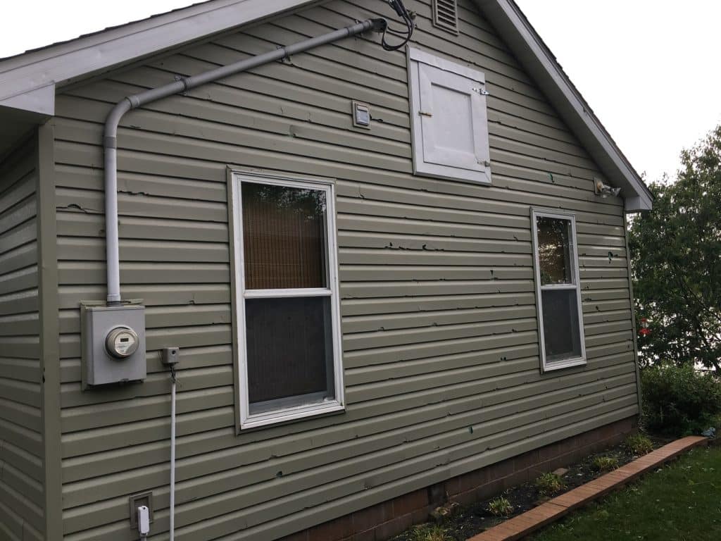 hail damage to vinyl siding