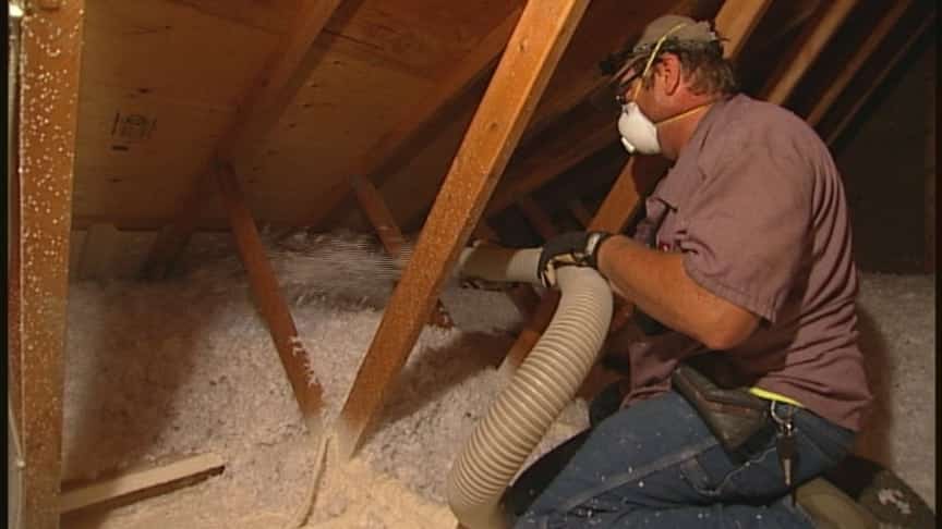 Adding blown fiberglass on spray foamed areas during insulation installation