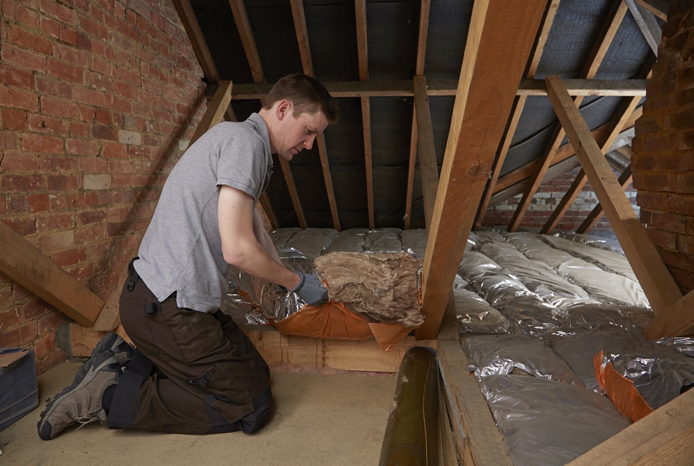  Insulation being installed in an attic