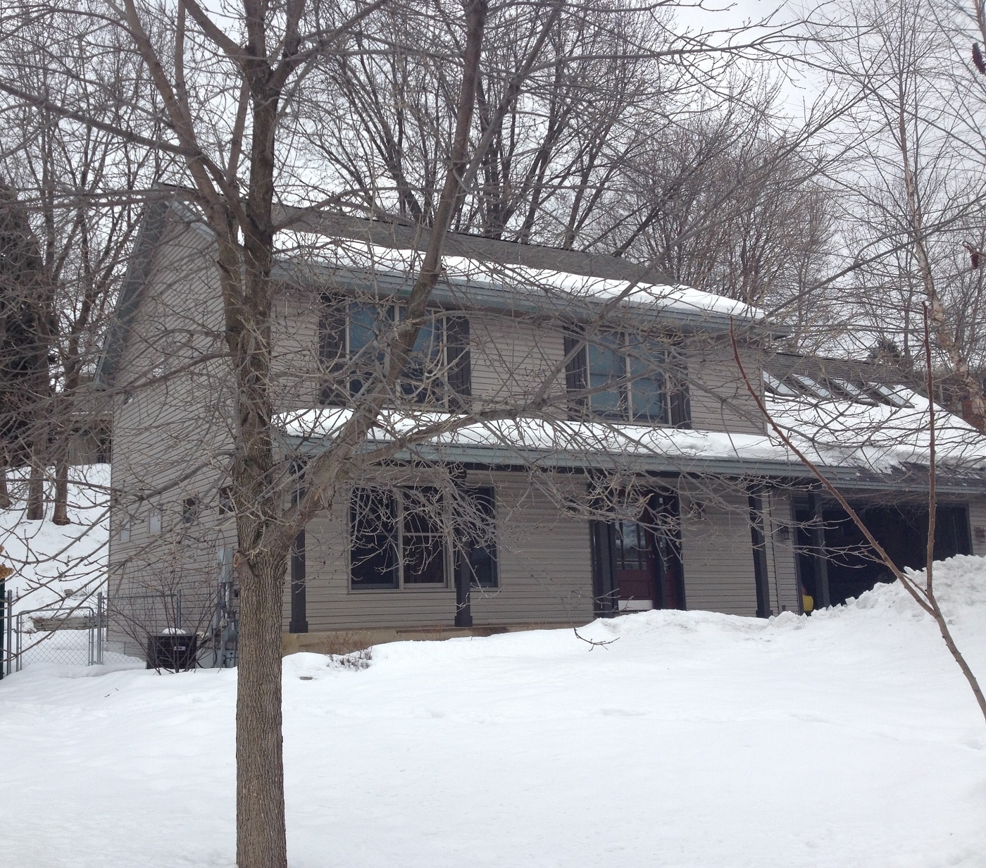 house in the winter with condensation on the windows