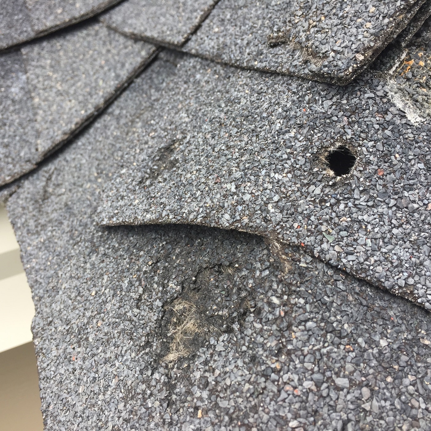 hole in roof caused by hail