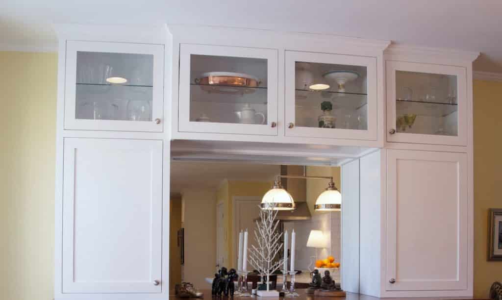 White kitchen cabinets with a glass front.