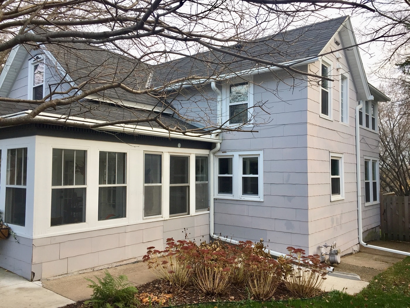 Home with trimmed trees and shrubs