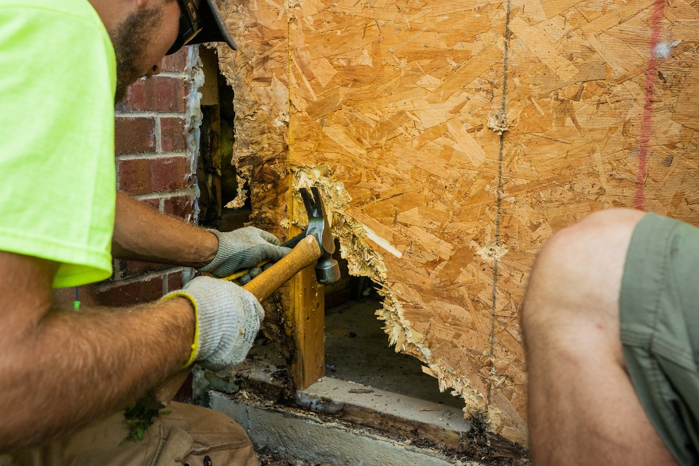 Lindus Construction worker repairing damaged sheathing