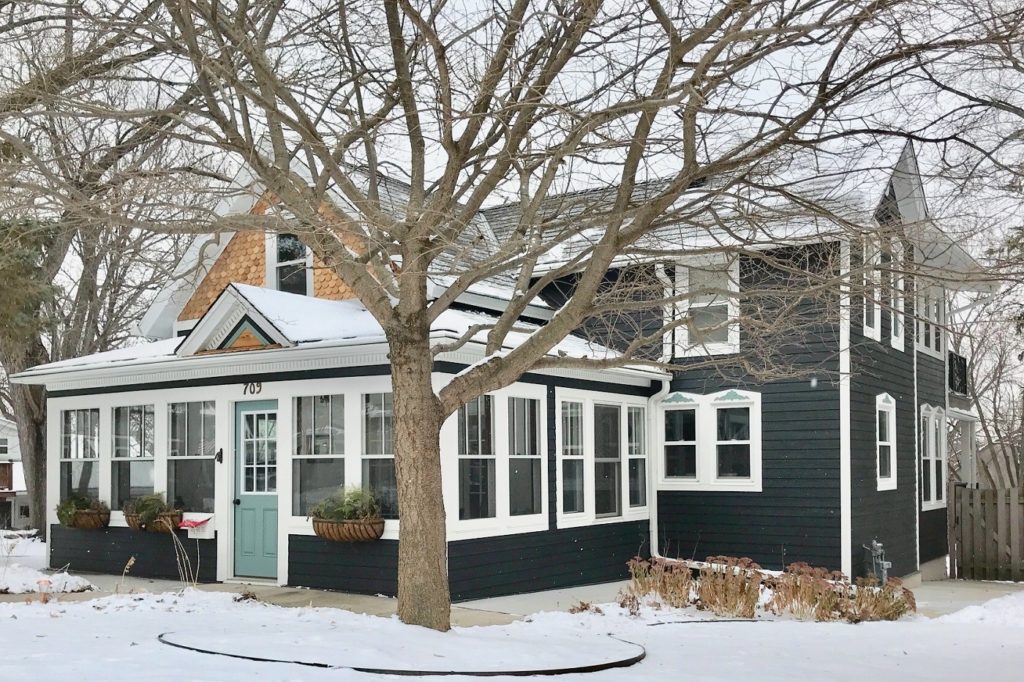 Engineered wood siding on a winter house.