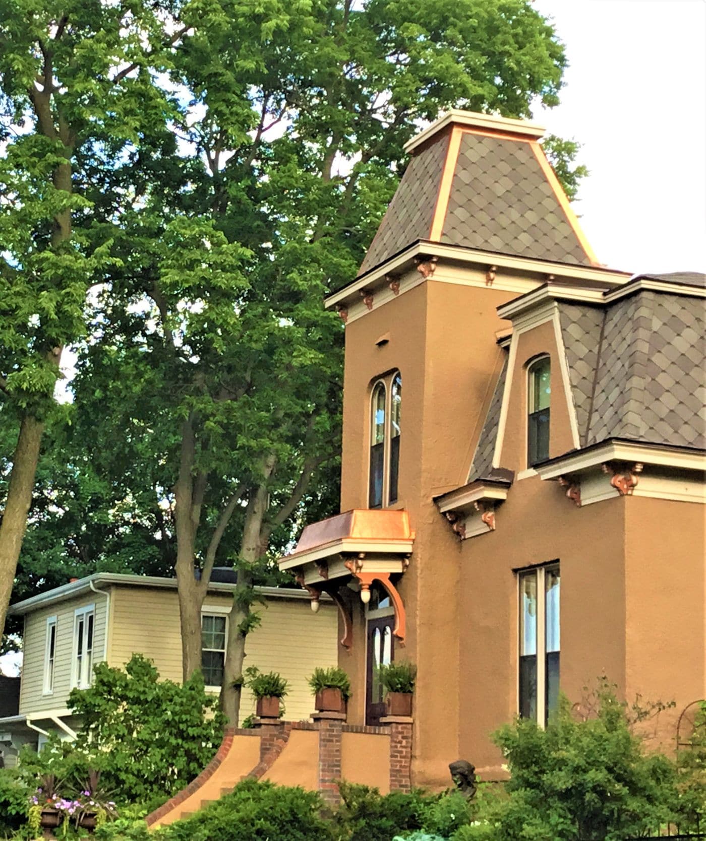  Copper accents & ridge caps installed on a historic Hastings home