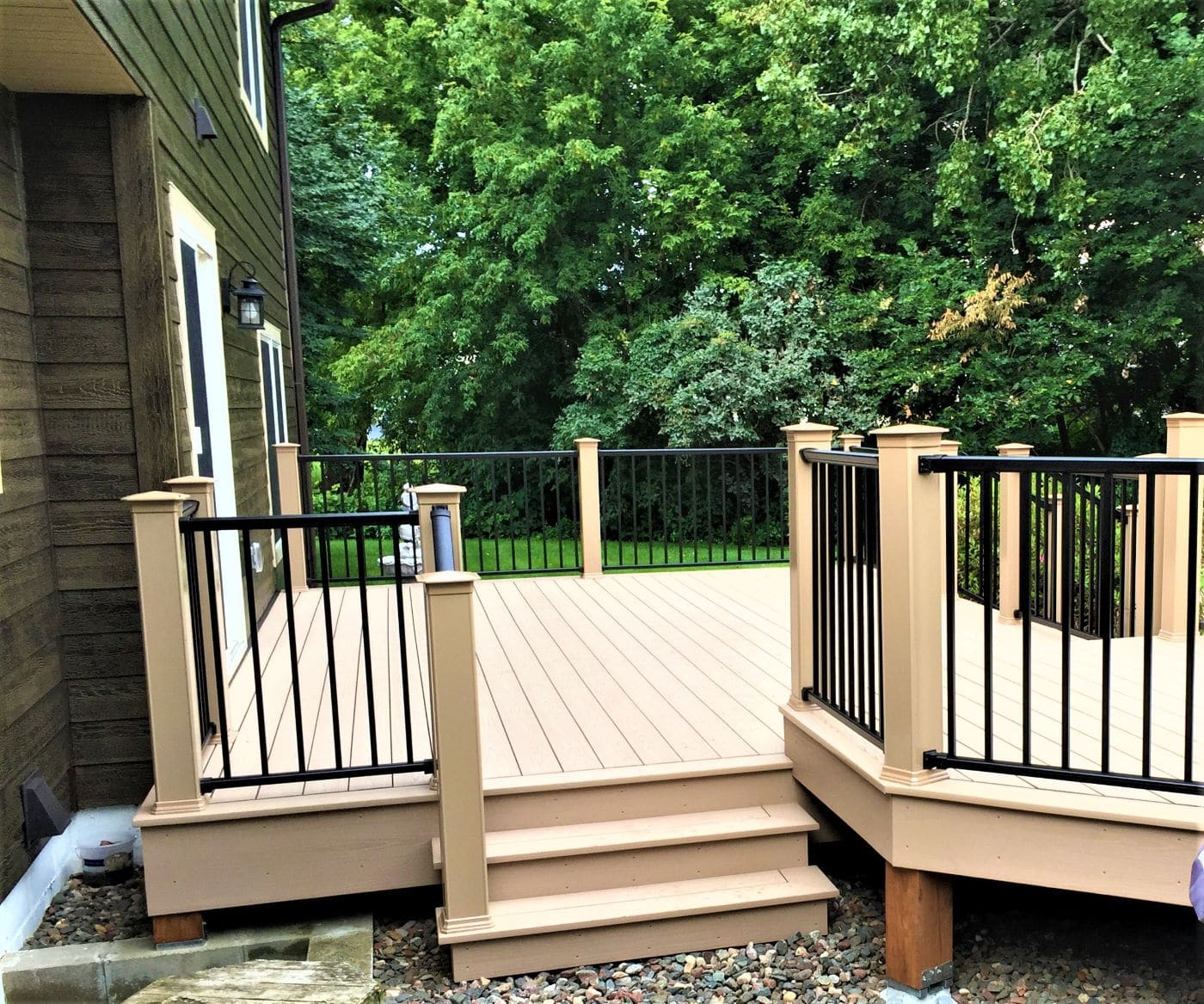 Composite deck installed on a home by Lindus Construction