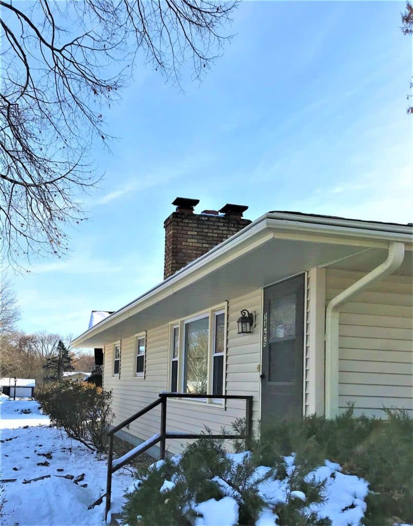 Aluminum gutter installation in the winter.