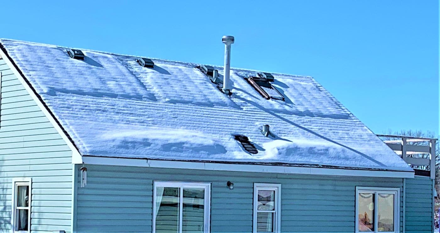  Ice dam on a home’s roof