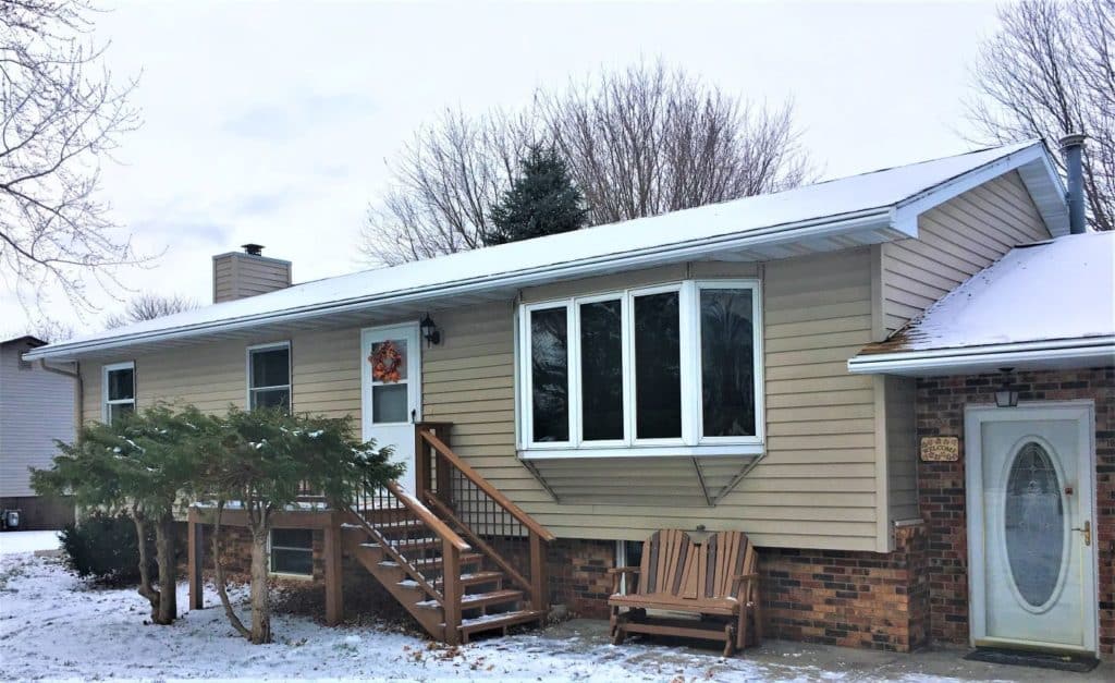 Gutter installation on a single level home in the winter.