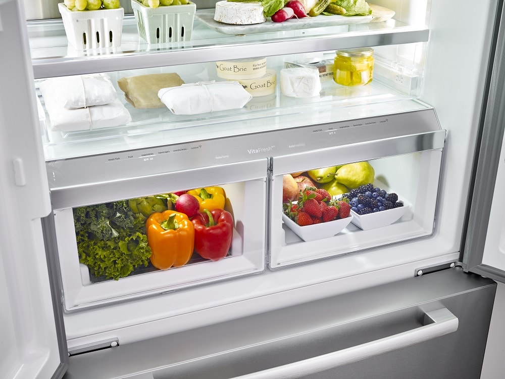 Refrigerator with fresh produce in it.