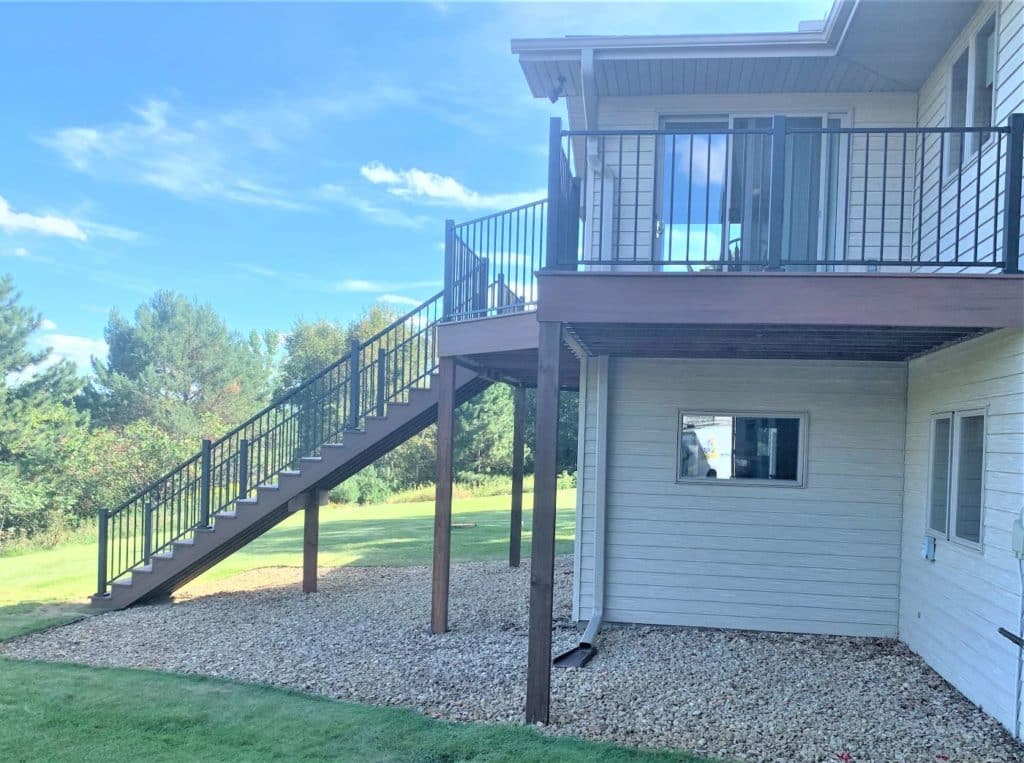 TimberTech Azek deck on a beige home.