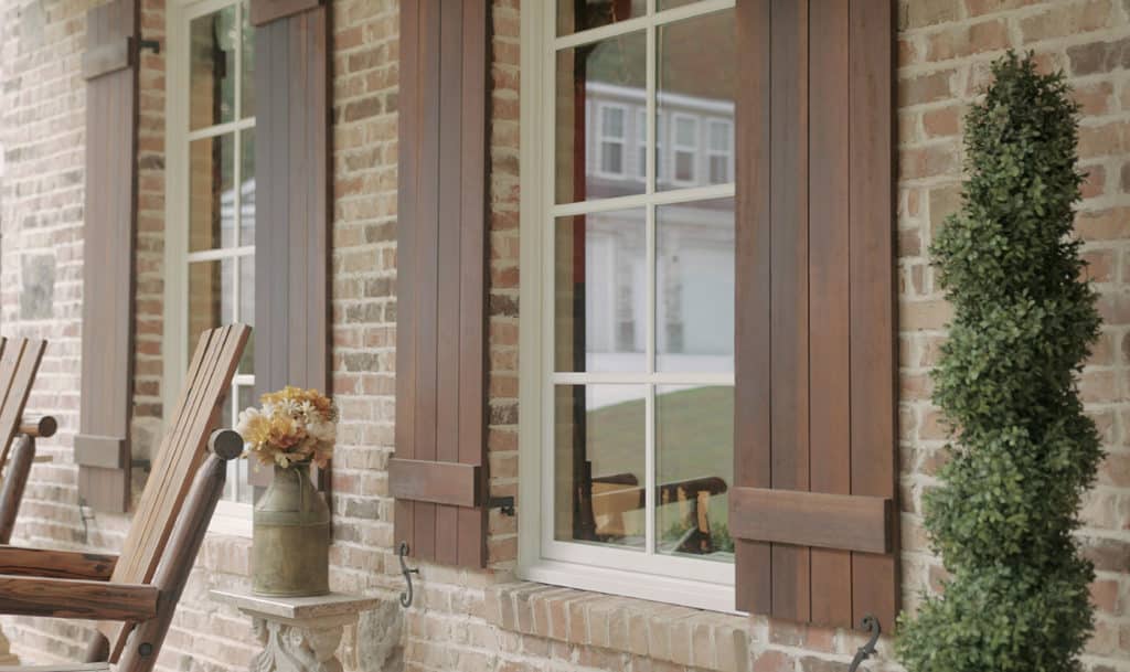Casement windows on a brick home.