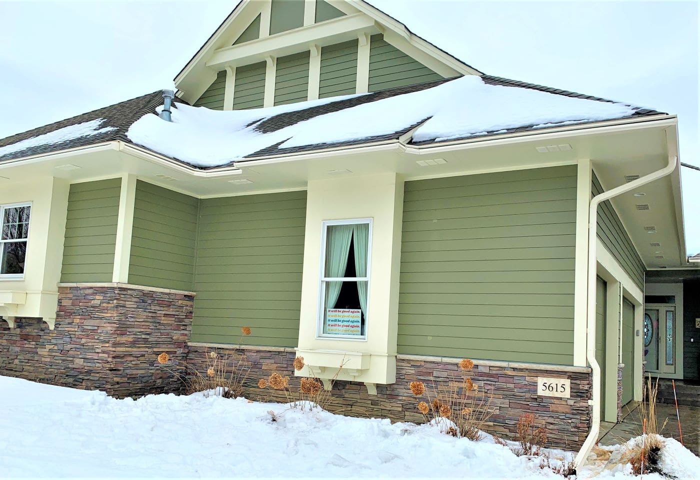 Green Plymouth home with LeafGuard Gutters