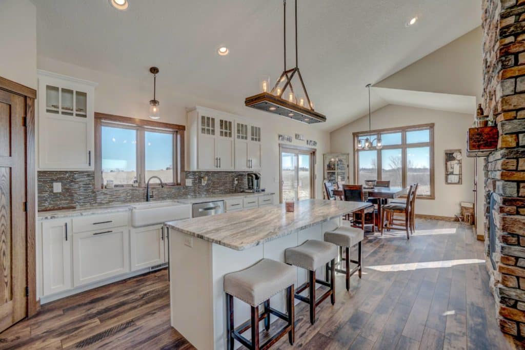 White custom kitchen cabinets in a rustic modern home.