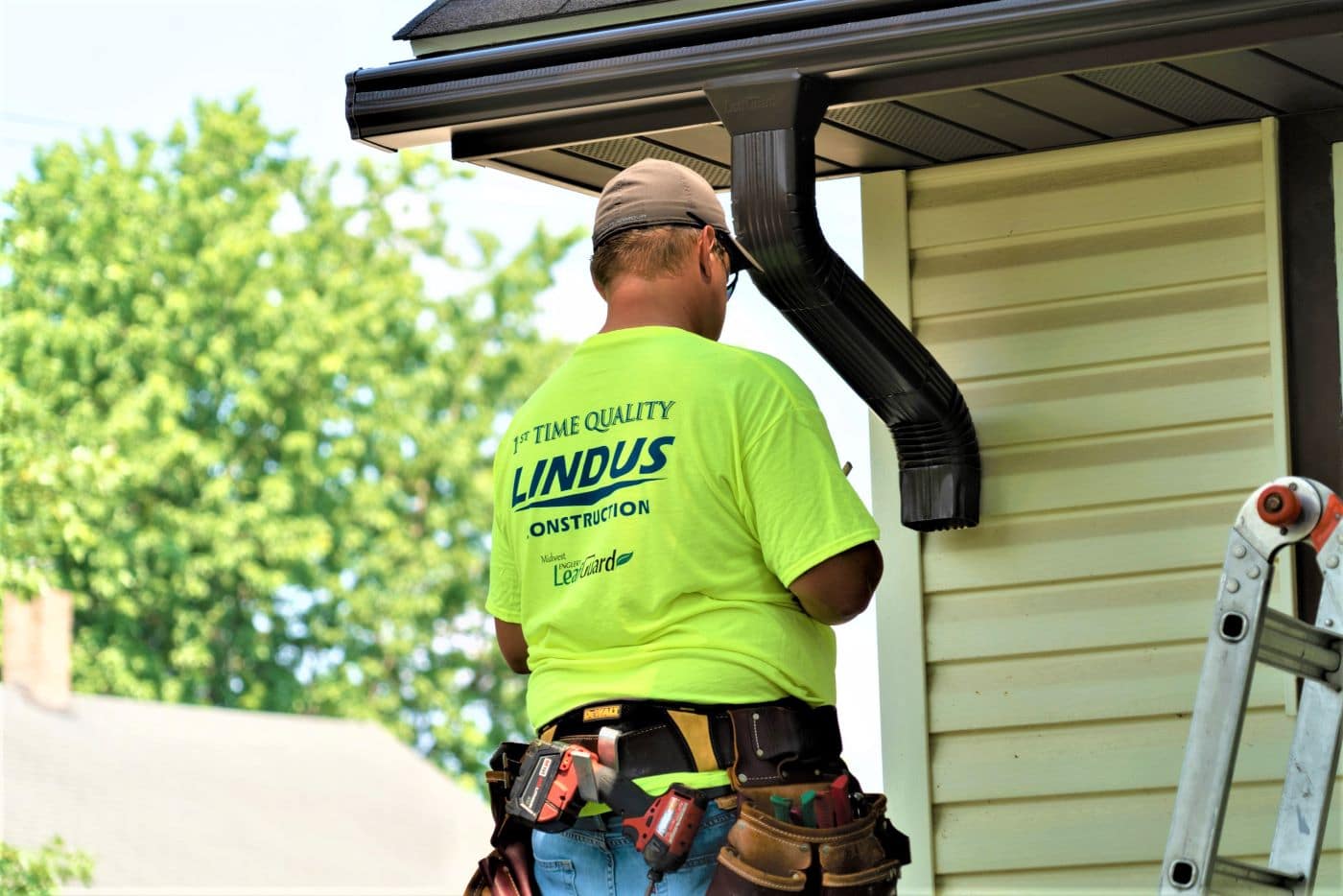 Lindus Construction installing LeafGuard Gutters 