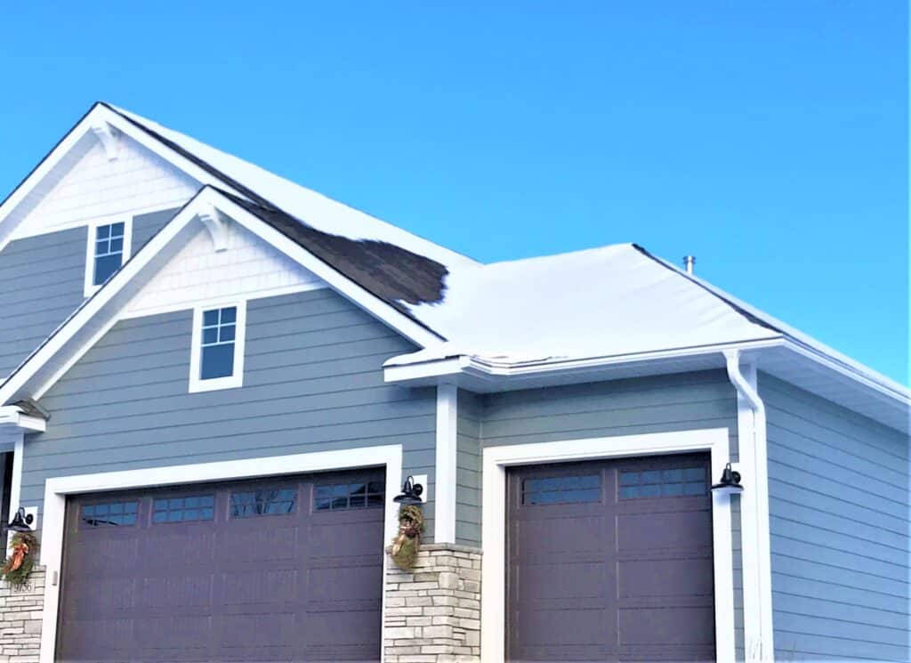 Gutter guards on a home in the winter.