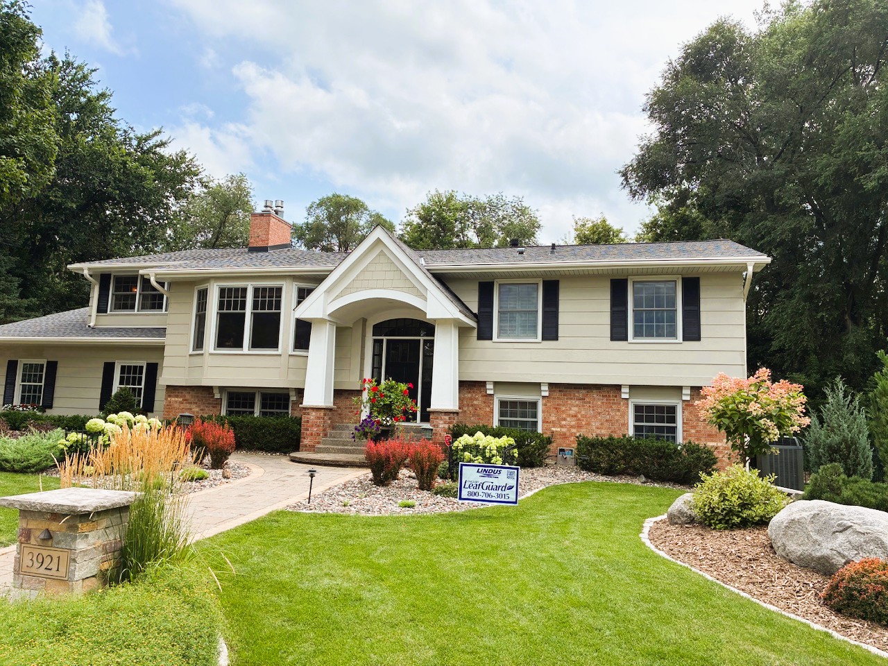 Home with a new roof, replacement windows, and LeafGuard® Brand Gutters