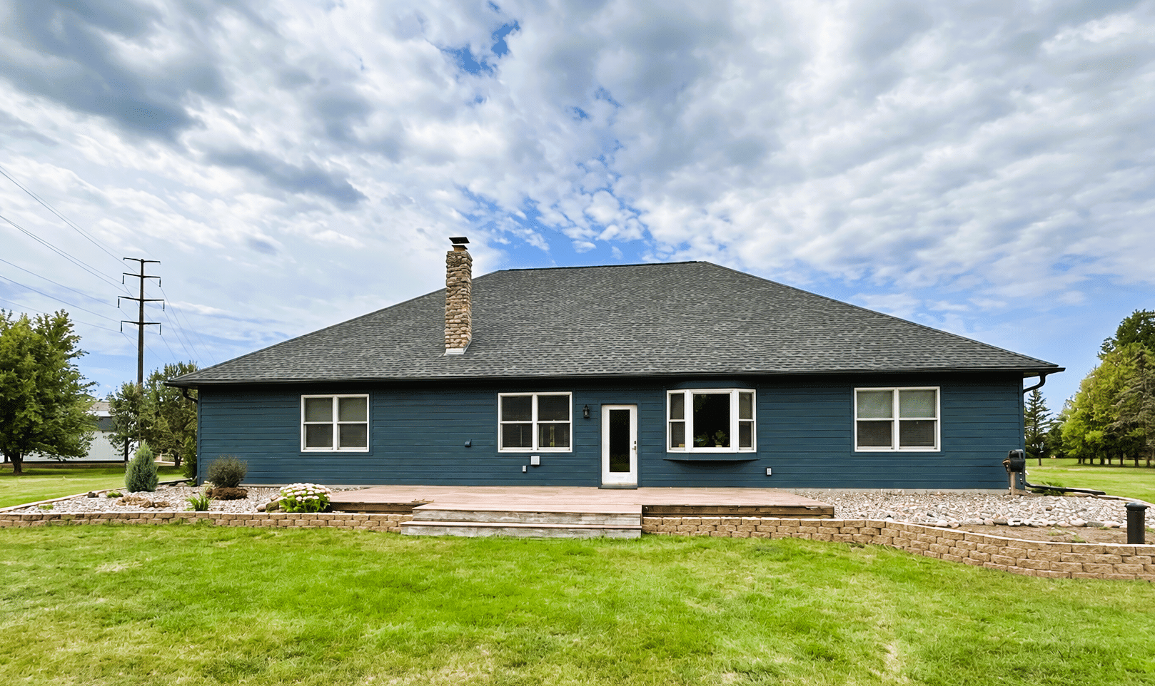 Home with new siding and LeafGuard® Brand Gutters installed by Lindus Construction